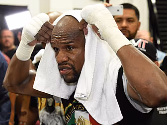 Mayweather retains undefeated...