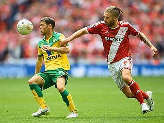 Canaries soar back to Premier...