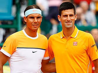 Nadal and Djokovic standing in...