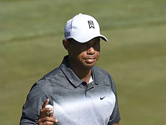 Tiger Woods in the dark over w...