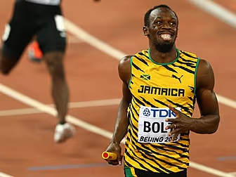 Bolt makes it three golds at W...