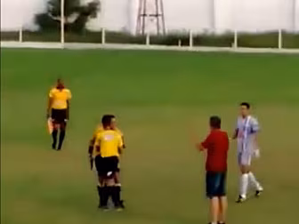 Referee pulls out a gun during...