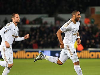 Ashley Williams leads from the...