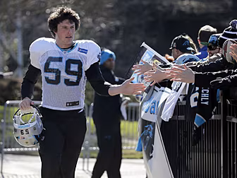 Carolina and Denver players be...