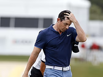 McIlroy and Harrington struggl...