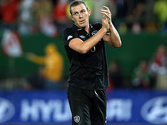 Richard Dunne swaps boots for...