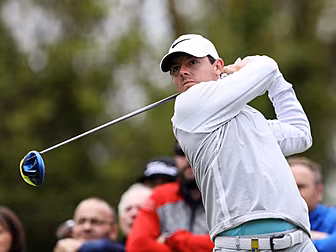 Rory McIlroy keeps pace at the...