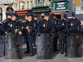 French riot police charge at E...