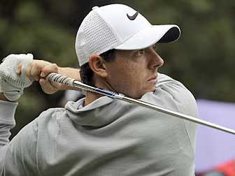McIlroy and Lowry struggle on...