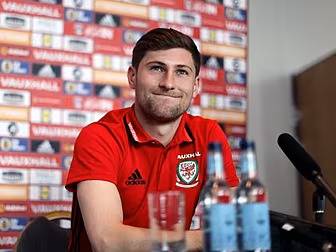 Wales' Ben Davies comforta...
