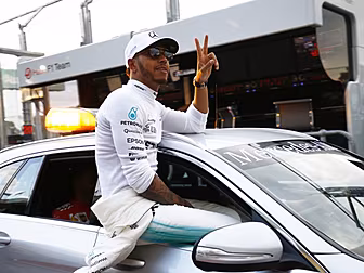 Lewis Hamilton takes pole posi...