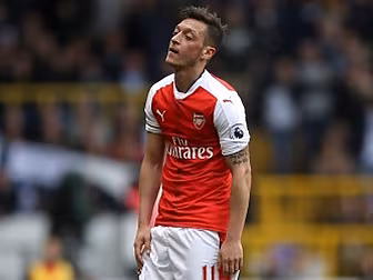 Mesut Ozil kicked a dressing r...
