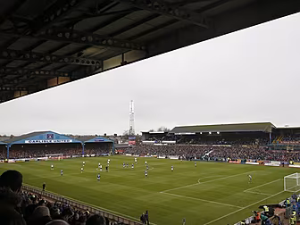 WATCH: Fans pour onto pitch in...