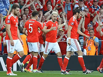 Wales hammer Russia to emerge...