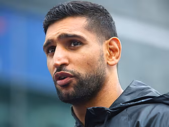 Khan challenges Pacquiao to Sa...