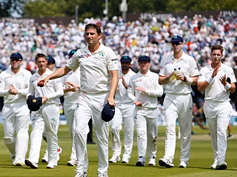 Ireland's cricketers stand on...