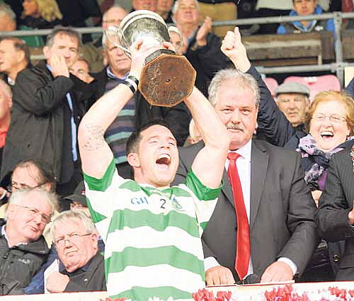 The moment of truth: Valley Rovers captain Noel ODonovan lifts the cup after his sides victory over Na Piarsaigh in the county PIFC final at P&aacute;irc U&iacute; Chaoimh.       