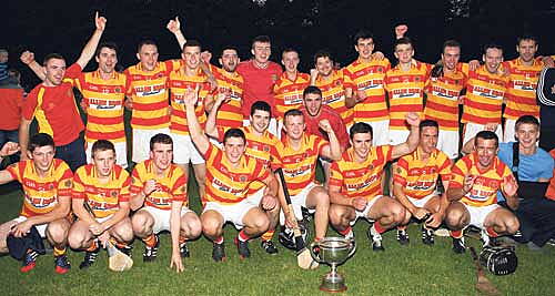 The wait is over: The Newcestown team celebrates after defeating Diarmuid &Oacute; Math&uacute;nas in the Kinetica junior A hurling championship final at Bandon.