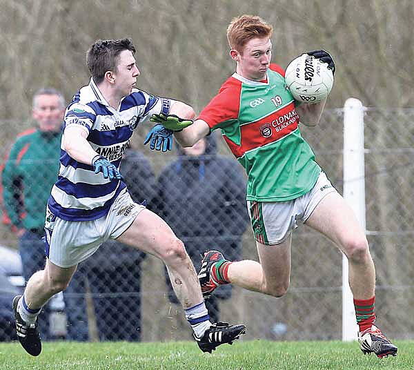 On the run: Clonakiltys Ross Mannix bursts past Castlehavens Brian Deasy during the Clona Milk U21 A football championship final at Rosscarbery on Sunday.