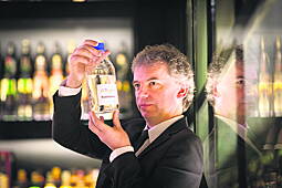 Prof Tangney surveying a bottle of biobutanol