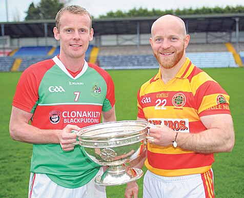 Derby date: First-round opponents Donal Lyons (Clonakilty) and Martin OBrien (Newcestown) pictured with the Andy Scannell Cup at the official launch of the Cork SFC in P&aacute;irc U&iacute; Rinn. 