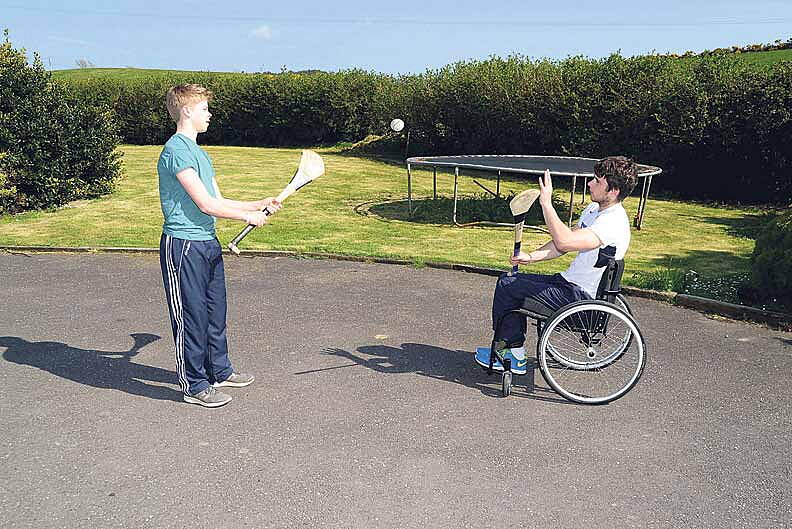Home comforts: Jamie Wall and his younger brother Philip enjoyed a puckaround at home in Kilbrittain.   
