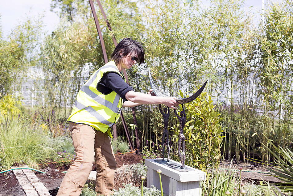 West Cork sculptor Clodagh Redden installing her bronze and ceramic piece for the sculpture garden at Bloom. (Photo: Emma Jervis)