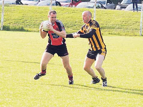 Former Clare senior footballer Noel Griffin (Kilbrittain) puts Shanballymores Jerome Fitzgerald under pressure during last Saturdays county junior B football championship game in Ballygarvan. 
