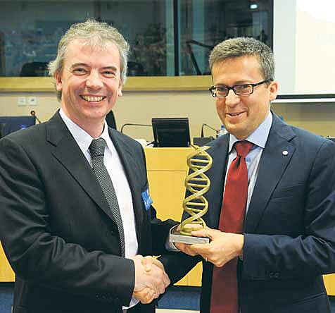 Professor Martin Tangney, originally from Macroom, being presented with the prestigious innovation award and a cheque for &not;10,000 at the European Parliament by Carlos Moedas, the EU Commissioner for Research, Science and Innovation.