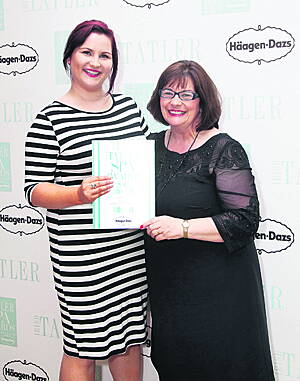 Lucy Williams, assistant spa manager, and Carol Rea, spa receptionist, receiving their award for Best Service for The Island Spa at Inchydoney Island Lodge at the Irish Tatler Spa Awards 2015.