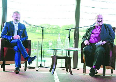 Graham Norton on stage with Bishop Paul Colton at the Maritime Hotel last Friday night.