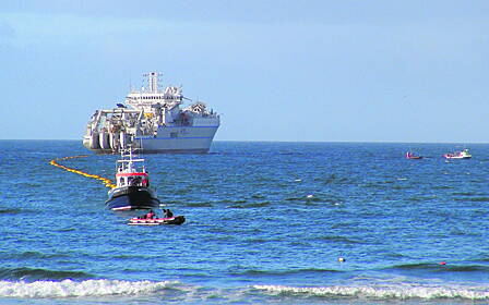 Ballinspittle man Joe Brennan took this photo from Garretstown beach on Monday last of the laying of the transatlantic cable for high speed internet, between Somerset and Nova Scotia, which came ashore here to create a link for Ireland