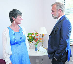 Tricia Lyne, ARC co-ordinator for West Cork, chatting to Graham Norton, guest of honour, at the official opening of the ARC Cancer Care Centre in Bantry on Thursday of last week.                                                                             