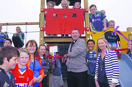 Fr Chris ODonovan cutting the tape to officially open the new Rath National School Playground funded by the Parents Association. Included in the photo are principal Maura Collins and Ruth Field, chairperson, Parents Association