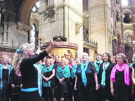 Caz Jeffreys leading her choirs in concert at St Finbarrs Cathedral in Cork earlier this summer.