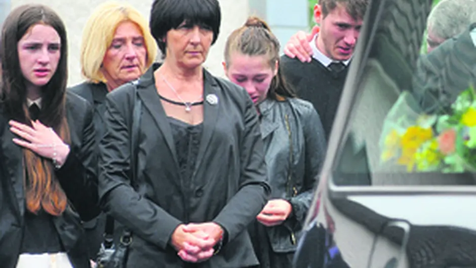 Ann Davis (third from left) chief mourner at the funeral, at the Sacred Heart Church in Rath, Baltimore, on Monday Image