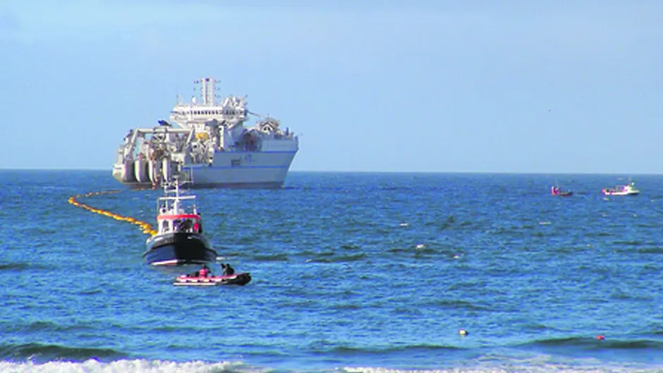 High speed 200m fibre optic cable comes ashore at Garretstown beach Image