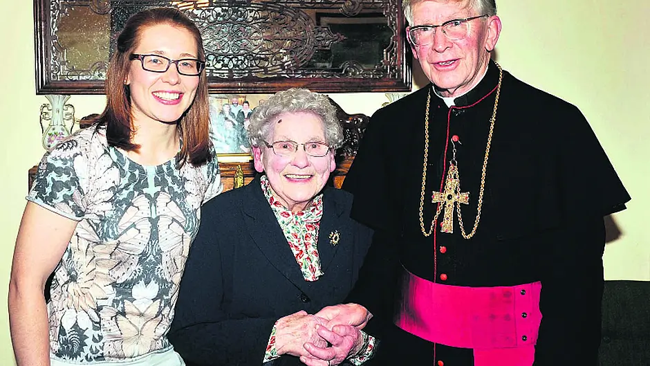 Bishop makes a special visit to his cousin Rena for her 98th birthday Image