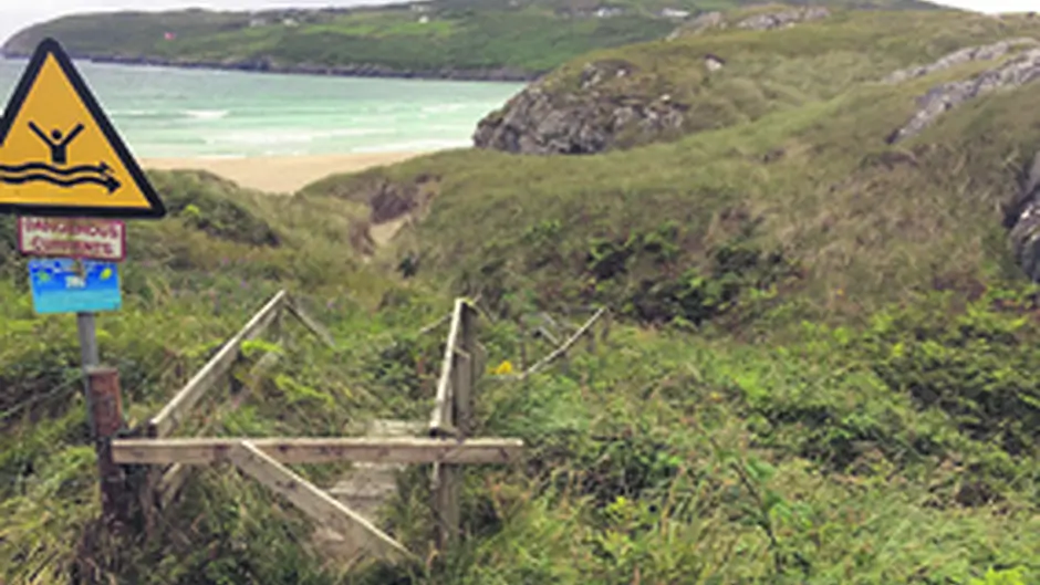 Dispute over beach access sees barbed wire coming and going Image