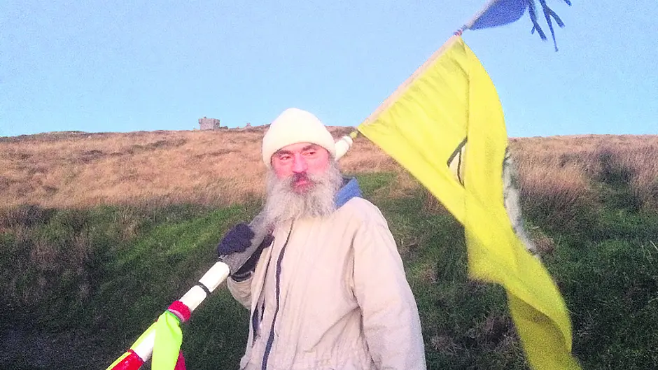 On pilgrim's busy path to browse over Brow Head Image