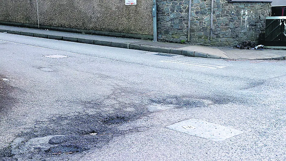 Cllr ‘hit a walloper' of a pothole Image