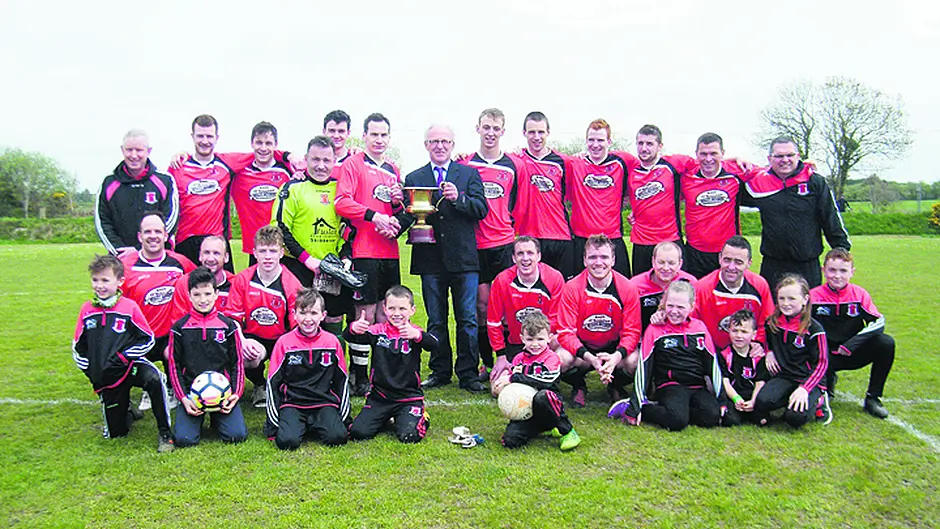 Oldham (52) gets his hands on Premier Division medal Image