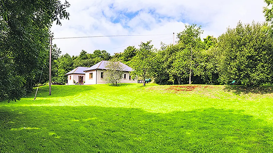 A river runs through it and a veranda wraps around this ‘gem' Image