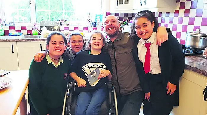 Singer Brian's good deed-y for his number one fan Jennifer Image