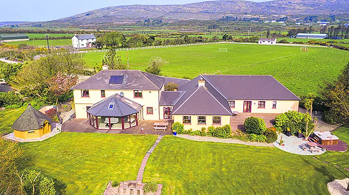 Lodge your interest in Schull home with a log cabin sauna and hot tub Image