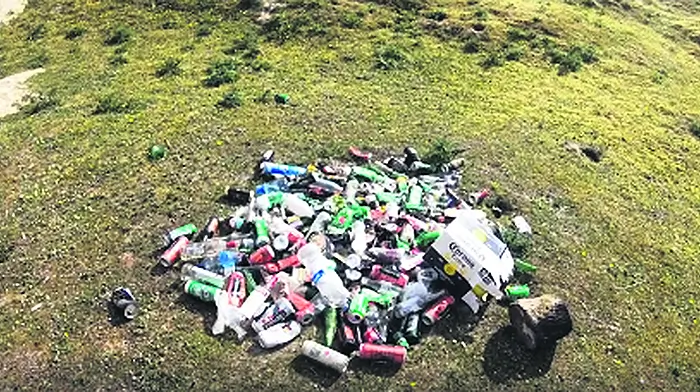Beer bottles and cans left behind at two popular beaches Image