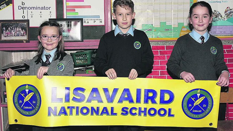 School's crest reflects village's history Image