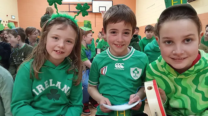 Pupils of Carrigboy National School Tiah Carroll O’Driscoll, Stephen O’Keefe and Sadie Ward enjoying the recent school’s Seachtain na Gaeilge concert.