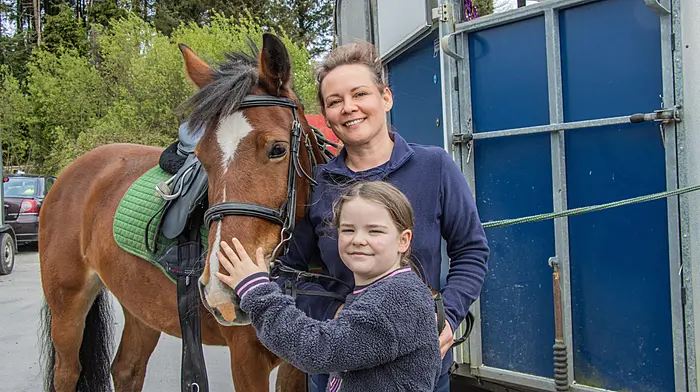 Supporting the fundraiser for their local playschool  at the Drinagh Cheval last weekend were Laura Scully, her daughter Madeline and their horse Stella. Right: John Regan, Yvonne Hagan and their dogs, Socks and Rex, and their horse Socks, at the cheval . (Photos: Gearoid Holland)