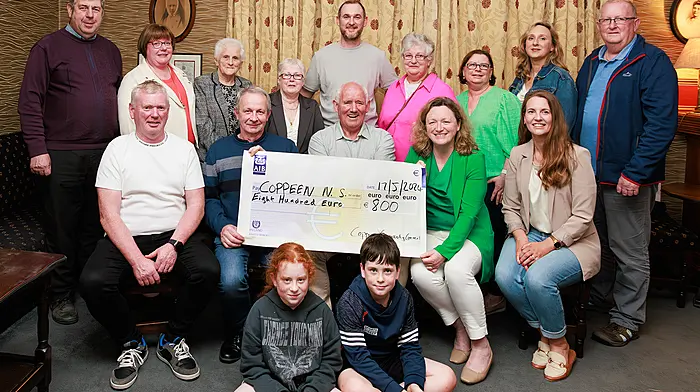 At the presentation of proceeds from Coppeen St Patrick's Day parade to Coppeen National School are (front, from left): Pat O'Driscoll (Castletown Ceili Dancers), Willie O'Mahony (Newcestown Comhaltas), Barry O'Sullivan (chair, Coppeen Community Council), Catherine Bradley (principal Coppeen National School) and Michelle Fox (Coppeen National School parents association) along with committee members and (seated, front) Alanna and Tomas O'Driscoll. (Photo: Therese Bourke)